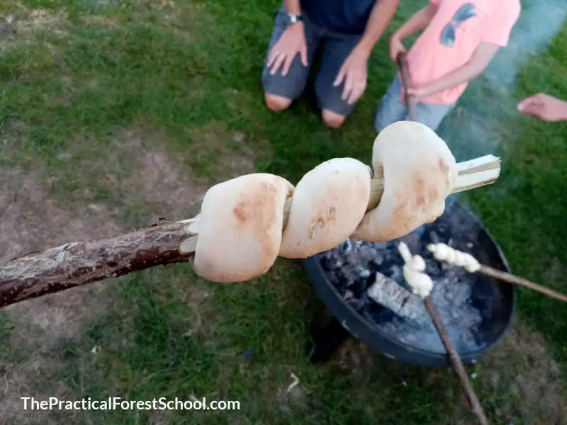 cooked bread on a stick