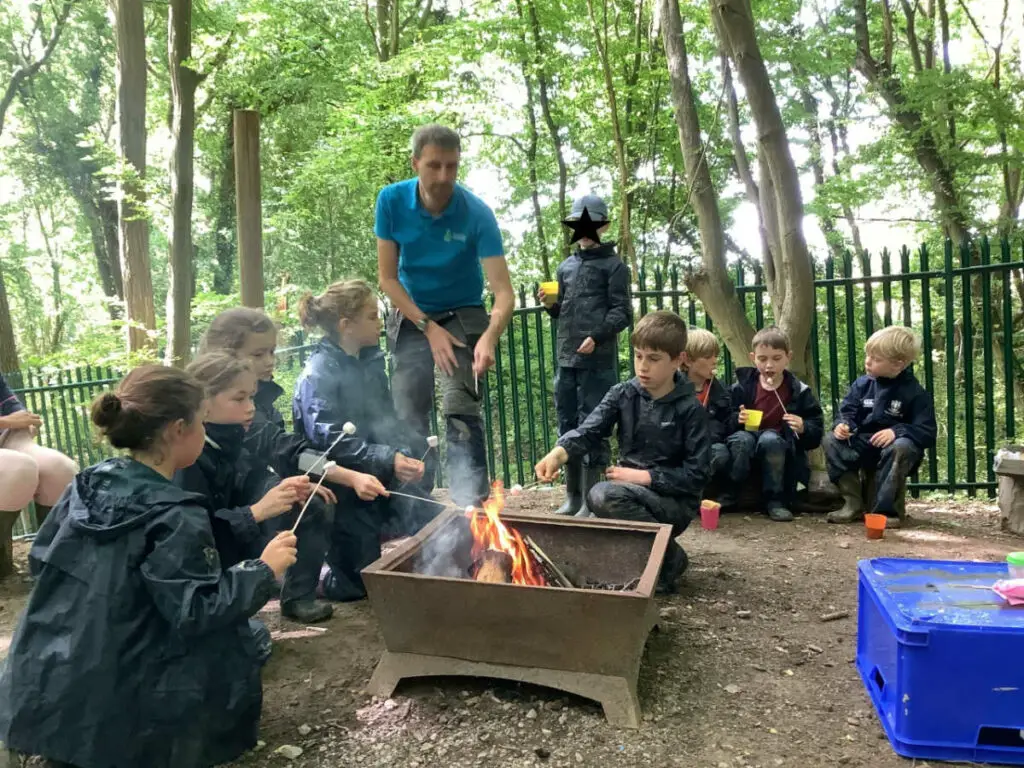 Jon with children at Pennthorpe School's forest school day.